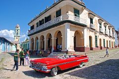 
The Palacio Brunet, now the Museo Romantico, is a two-storey mansion in warm yellow stucco on Plaza Mayor in Trinidad de Cuba. The ground floor of the Palacio Brunet was built in 1740, and the upstairs was built in 1808. It was once owned by a sugar baron, but was converted into a museum in 1974. On the left with the yellow and green bell-tower is the former convent of San Francisco de Ass, now the Museo Nacional de la Lucha Contra Bandidos.
